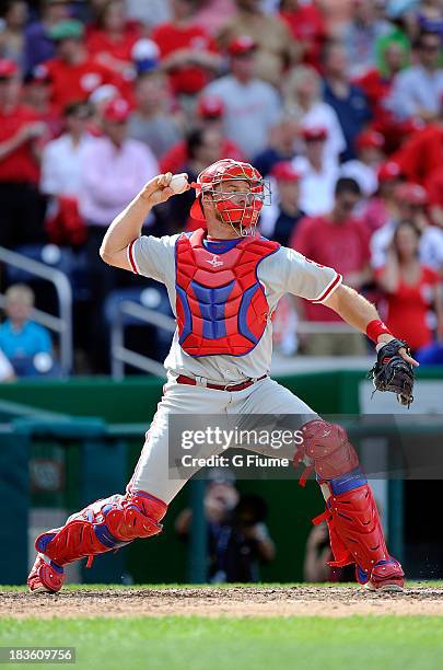 Erik Kratz of the Philadelphia Phillies throws the ball to second base against the Washington Nationals at Nationals Park on September 15, 2013 in...