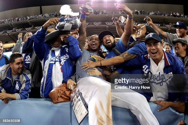 Hanley Ramirez of the Los Angeles Dodgers celebrates with fans after the Dodgers defeat the Atlanta Braves 4-3 in Game Four of the National League...