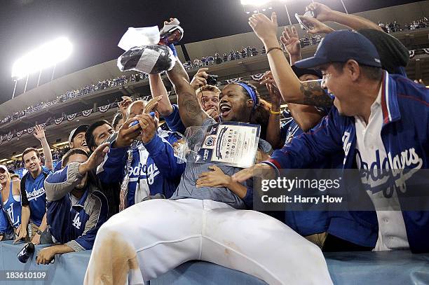 Hanley Ramirez of the Los Angeles Dodgers celebrates with fans after the Dodgers defeat the Atlanta Braves 4-3 in Game Four of the National League...