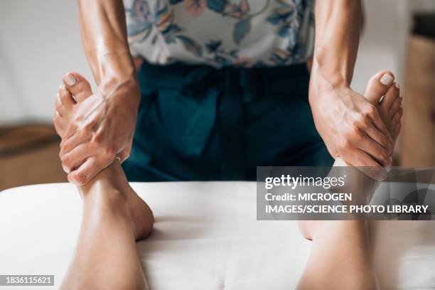 ayurvedic foot massage - two human feet stock pictures, royalty-free photos & images