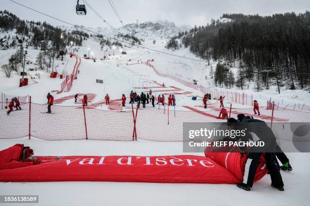 Competition staff fold the finish line arrival inflatable gate as the Men's Slalom event of the FIS Alpine Ski World Championship 2023 in Val d'Isere...