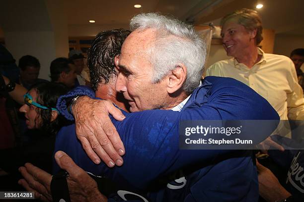 Manager Don Mattingly of the Los Angeles Dodgers celebrates with Dodgers legend Sandy Koufax after the Dodgers defeat the Atlanta Braves 4-3 in Game...