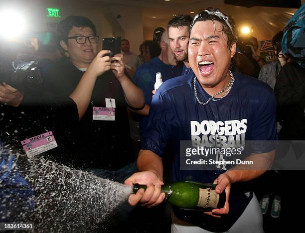 Hyun-Jin Ryu of the Los Angeles Dodgers celebrates in the locker room after the Dodgers defeat the Atlanta Braves 4-3 in Game Four of the National...
