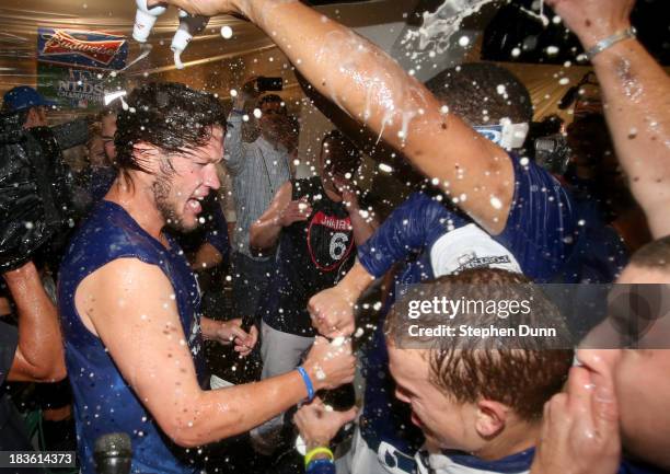 Clayton Kershaw of the Los Angeles Dodgers celebrates in the locker room after the Dodgers defeat the Atlanta Braves 4-3 in Game Four of the National...