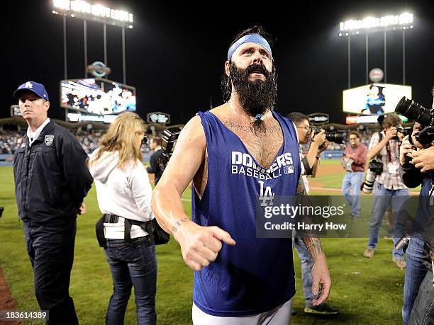 Brian Wilson of the Los Angeles Dodgers celebrates on the field after the Dodgers defeat the Atlanta Braves 4-3 in Game Four of the National League...