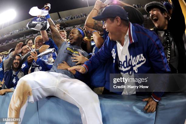 Hanley Ramirez of the Los Angeles Dodgers celebrates with fans after the Dodgers defeat the Atlanta Braves 4-3 in Game Four of the National League...