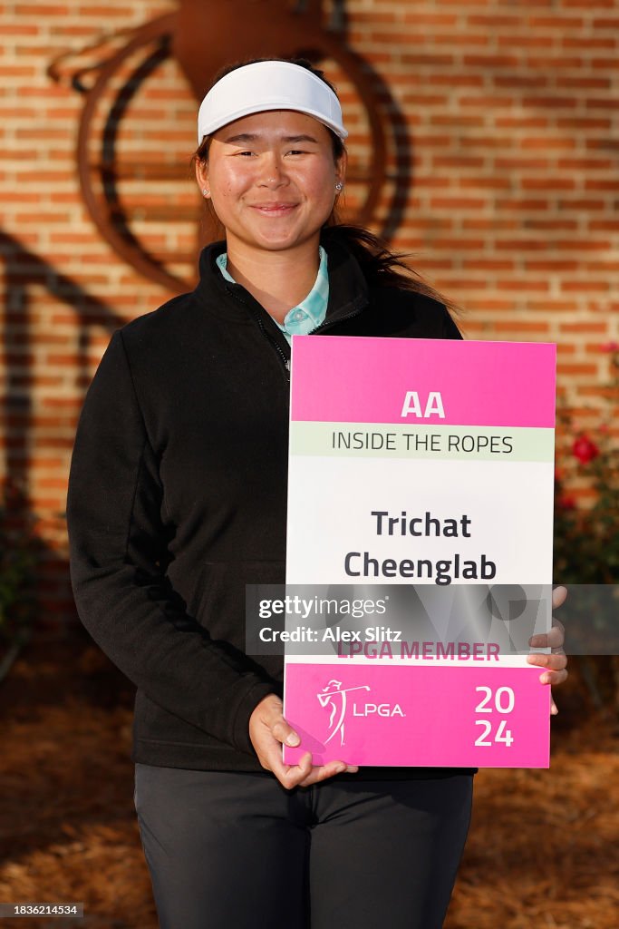 Trichat Cheenglab of Thailand poses with the tour card after the