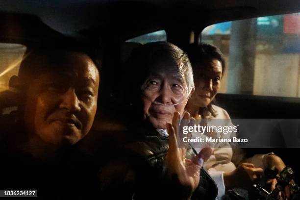 Former president of Peru Alberto Fujimori exits in a car with son Kenji Fujimori and daughter Keiko Fujimori the Barbadillo prison after being...