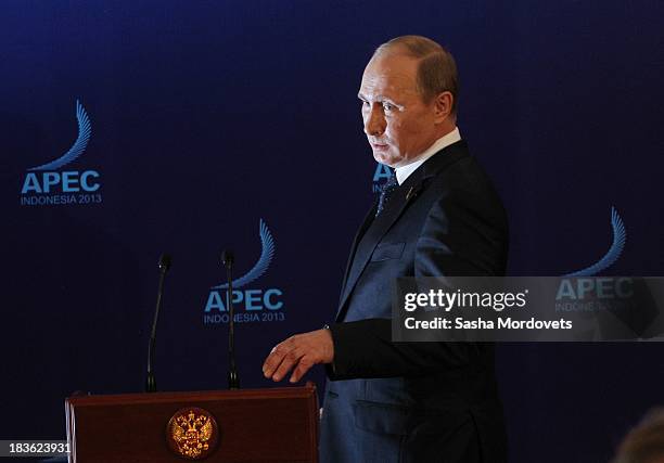 Russian President Vladimir Putin arrives to give a press conference at the APEC Leaders Summit on October 8, 2013 in Denpadsar, Bali, Indonesia. US...