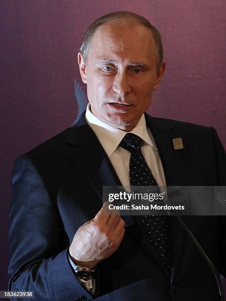 Russian President Vladimir Putin gives a press conference at the APEC Leaders Summit on October 8, 2013 in Denpadsar, Bali, Indonesia. US President...