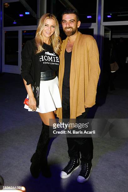 Fashion designers Ivana Sert and Hakan Akkaya attend Mercedes-Benz Fashion Week Istanbul s/s 2014 presented by American Express on October 7, 2013 in...