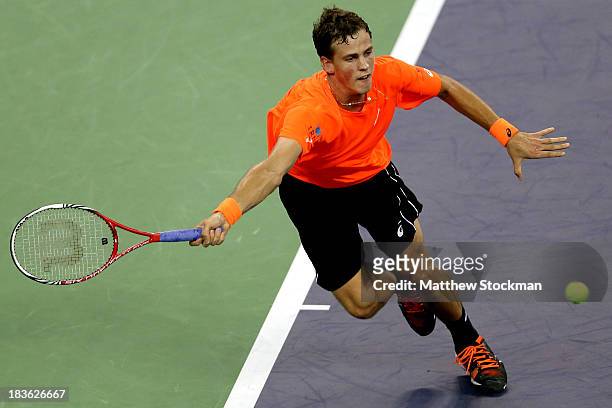 Vasek Pospisil of Canada lunges for a shot while playing Richard Gasquet of France during the Shanghai Rolex Masters at the Qi Zhong Tennis Center on...