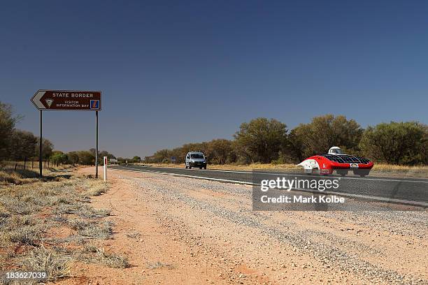 Luminos of the Stanford Solar Car Project, Stanford University in the United States of America races across the border between the Northern Territory...