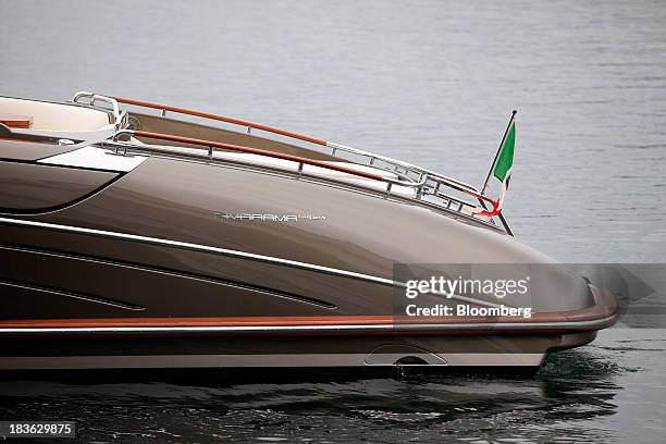 Rivarama Super logo sits on the hull of a luxury yacht, manufactured by Ferretti Group, as it prepares to dock at the company's shipyard in Sarnico,...