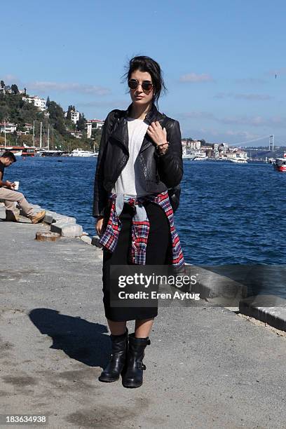 Gamze Biran wears a Mango coat, a Puma shirt, Inci shoes and Divarese bag during Mercedes-Benz Fashion Week Istanbul s/s 2014 presented by American...