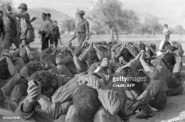 Israeli officers prisoners captured by Syrian troops on the Golan front sit on October 16, 1973 in the Damas area during the 1973 Arab-Israeli War....