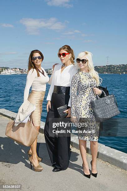 Dalya Sulaimon wears an Herve Leger skirt, Network top and shoes and Louis Nicholas accessories, Elif Celef wears Que top and a Michael Kors bag,...