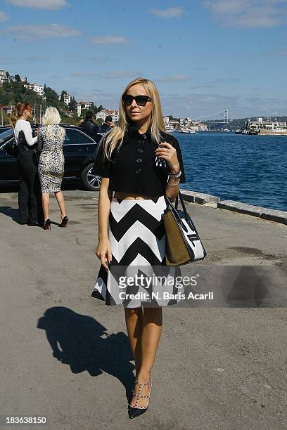 Aysun Karaalioglu wears Mango jacket, Karen Miller skirt, Valentino shoes and a Celine bag during Mercedes-Benz Fashion Week Istanbul s/s 2014...