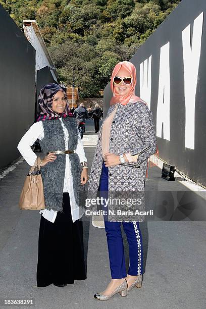 Betul Kahraman wears a Ipekyol top, Sofia Baldi shoes, Hermes bag and a Carvella scarf, Tugba Saracoglu wears Beymen Club jacket and top, Fashion...