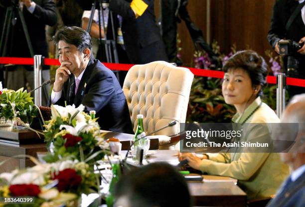 Japanese Prime Minister Shinzo Abe and South Korean President Park Geun-hye attend the APEC summit on October 7, 2013 in Nusa Dua, Indonesia. US...