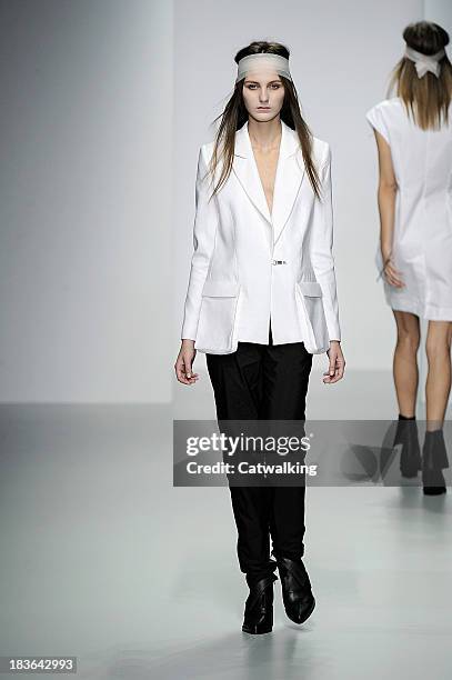 Model walks the runway at the Haizhen Wang Spring Summer 2014 fashion show during London Fashion Week on September 17, 2013 in London, United Kingdom.