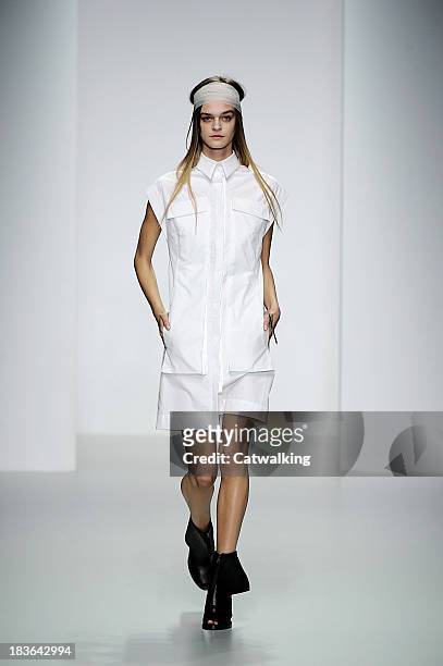 Model walks the runway at the Haizhen Wang Spring Summer 2014 fashion show during London Fashion Week on September 17, 2013 in London, United Kingdom.