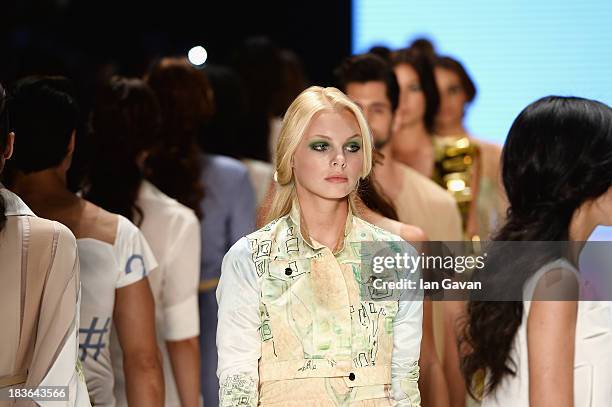 Models walk the runway at the Red Beard By Tanju Babacan show during Mercedes-Benz Fashion Week Istanbul s/s 2014 presented by American Express on...