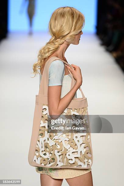 Model Wilma Elles walks the runway at the Red Beard By Tanju Babacan show during Mercedes-Benz Fashion Week Istanbul s/s 2014 presented by American...