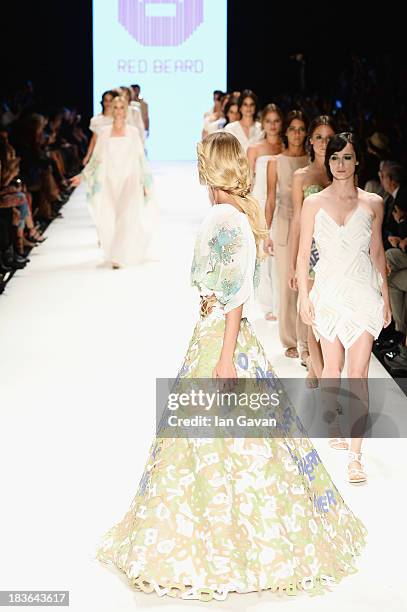 Model Didem Soydan walks the runway at the Red Beard By Tanju Babacan show during Mercedes-Benz Fashion Week Istanbul s/s 2014 presented by American...