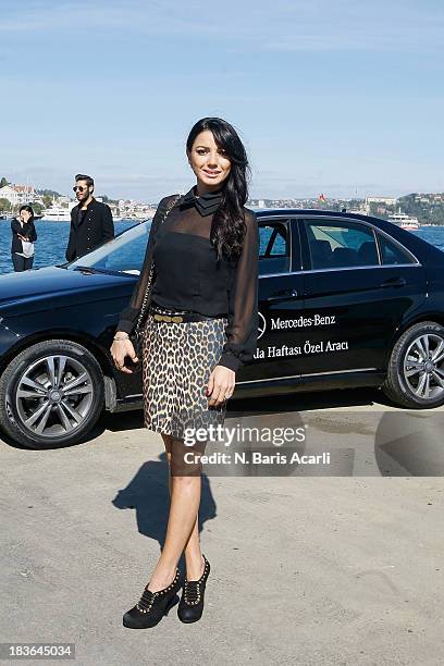 Bilge Karadeniz wears an Enmoda.com skirt, a Homestore top, a Chanel bag and Dior shoes during Mercedes-Benz Fashion Week Istanbul s/s 2014 presented...