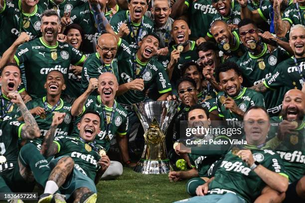 Players of Palmeiras celebrate with the champion trophy after winning the match between Cruzeiro and Palmeiras as part of Brasileirao 2023 at...