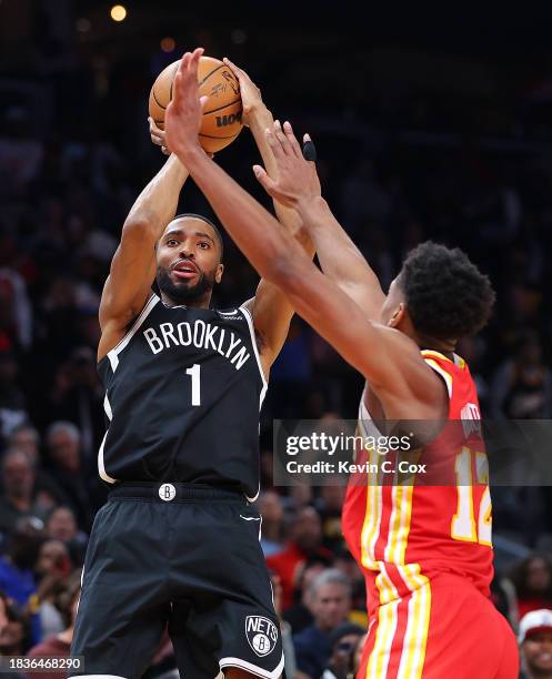 Mikal Bridges of the Brooklyn Nets hits what ends up being the game-winning basket against De'Andre Hunter of the Atlanta Hawks in the final seconds...