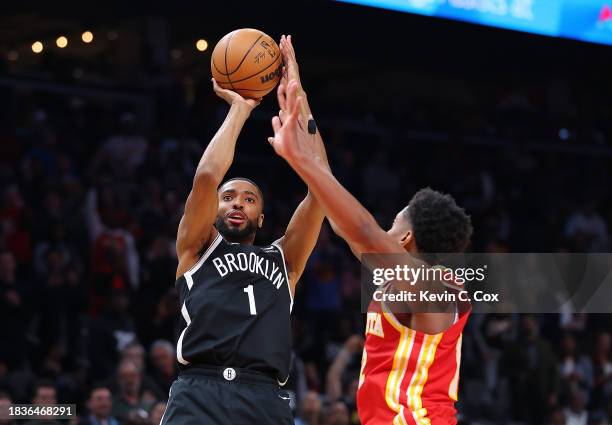 Mikal Bridges of the Brooklyn Nets hits what ends up being the game-winning basket against De'Andre Hunter of the Atlanta Hawks in the final seconds...