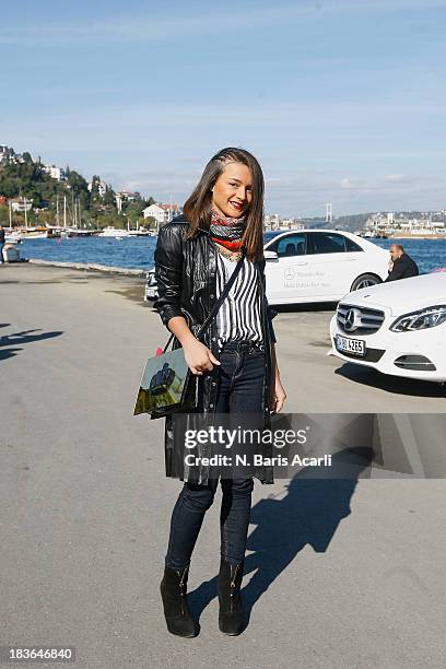 Irmak Ekim wears a Celine jacket, a Did by Did bag and Zara shoes during Mercedes-Benz Fashion Week Istanbul s/s 2014 presented by American Express...