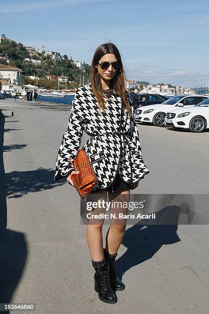 Ceren Gungor wears Zara and a Burberry bag during Mercedes-Benz Fashion Week Istanbul s/s 2014 presented by American Express on October 7, 2013 in...