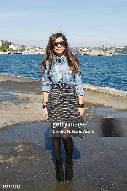 Zeinep Ceylan wears a Kiki Riki top, a Topshop skirt and Mango shoes and bag during Mercedes-Benz Fashion Week Istanbul s/s 2014 presented by...