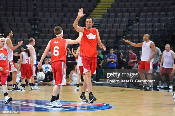 Former NBA player Vlade Divac helps out during the NBA Cares Special Olympics Unified Sports Basketball Game at the NBA Global Games in the Phones4U...