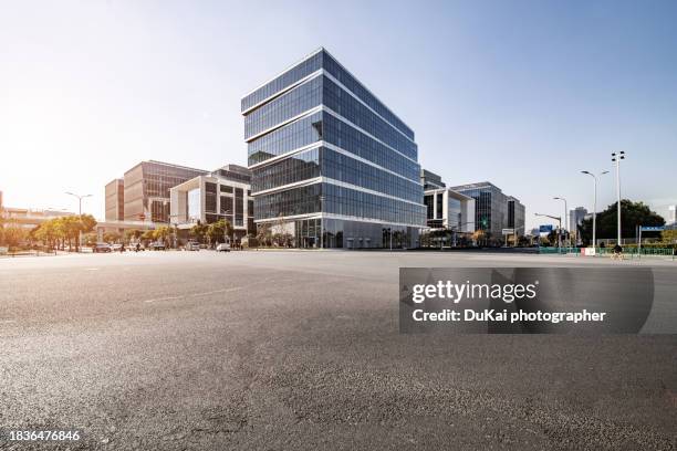 city asphalt empty road - skyscraper stock pictures, royalty-free photos & images