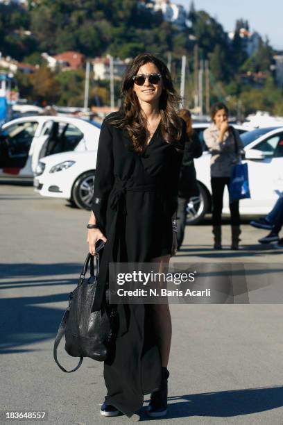 Billur Saatci wears Zeynep Okmen dress, Alexander Wang shoes, Pour La Victoire bag and Ekria accessories during Mercedes-Benz Fashion Week Istanbul...