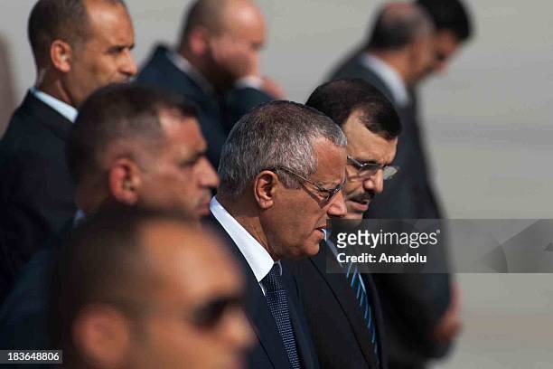 Libyan PM Ali Zeidan arrives in Tunisia on October 8. Zeidan is welcomed by his Tunisian counterpart Ali Laarayedh at Carthage Airport.