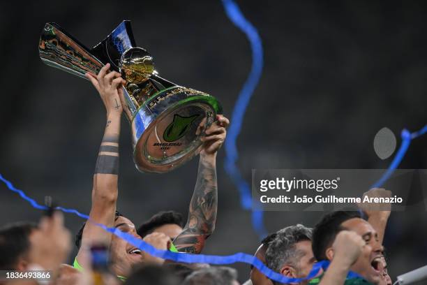 Players of Palmeiras celebrate with the trophy after winning the match between Cruzeiro and Palmeiras as part of Brasileirao 2023 at Mineirao Stadium...