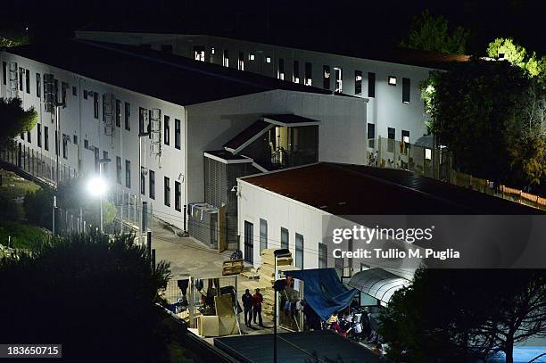 The temporary shelter Center where immigrants are detained after their arrival on the island is seen on October 8, 2013 in Lampedusa, Italy. The...