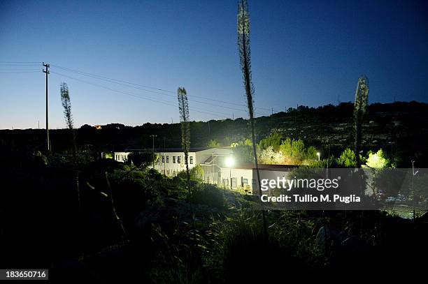 The temporary shelter Center where immigrants are detained after their arrival on the island is seen on October 8, 2013 in Lampedusa, Italy. The...