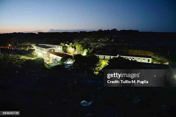 The temporary shelter Center where immigrants are detained after their arrival on the island is seen on October 8, 2013 in Lampedusa, Italy. The...