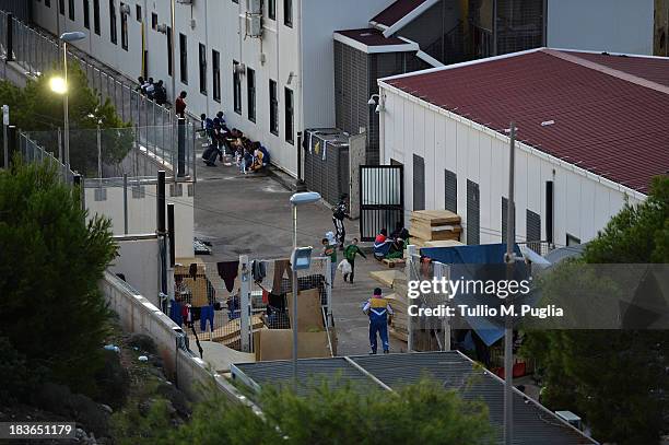 The temporary shelter Center where immigrants are detained after their arrival on the island is seen on October 8, 2013 in Lampedusa, Italy. The...