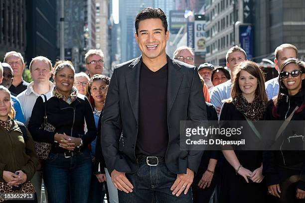 Mario Lopez hosts "Extra" in Times Square on October 8, 2013 in New York City.