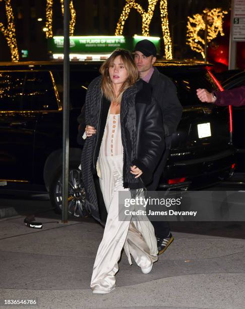 Suki Waterhouse and Robert Pattinson arrive to the "Poor Things" premiere after party in Midtown Manhattan on December 06, 2023 in New York City.