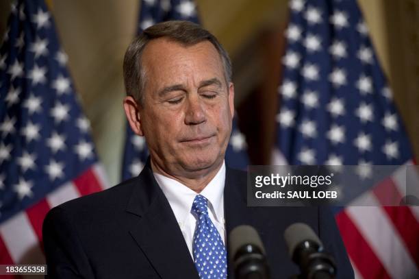 Speaker of the House John Boehner speaks at the US Capitol in Washington, DC, October 8 following a press conference by US President Barack Obama at...