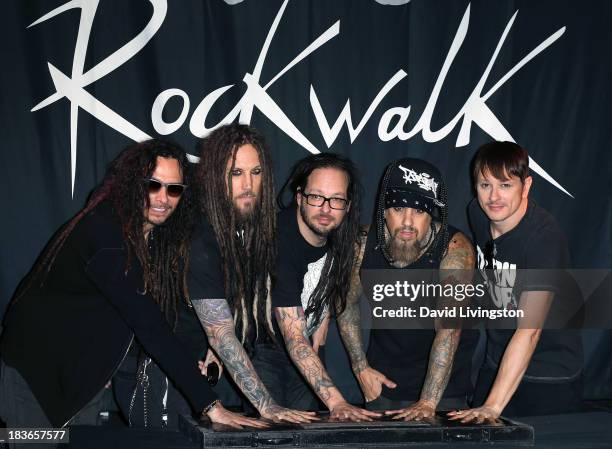 Musicians James "Munky" Shaffer, Brian Welch, Jonathan Davis, Reginald "Fieldy" Arvizu and Ray Luzier of Korn attend Korn's induction into Guitar...