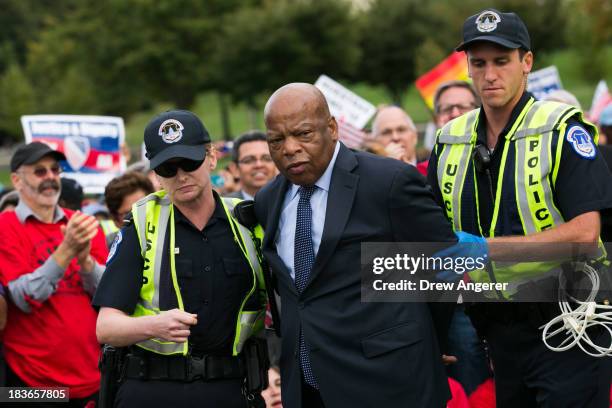 Rep. John Lewis is arrested by U.S. Capitol Police after blocking First Street NW in front of the U.S. Capitol with fellow supporters of immigration...